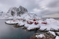 Landscape of the Lofoten Islands in Norway with traditional wooden red fisherman huts in front of the sea and this beautiful mouta Royalty Free Stock Photo