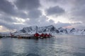 Landscape of the Lofoten Islands in Norway with traditional wooden red fisherman huts in front of the sea and this beautiful mouta Royalty Free Stock Photo