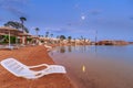 Landscape of lonely beachchair near sea and beautiful sunset