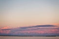 Landscape long bridge over a sea plait on a beautiful pink sunset Royalty Free Stock Photo