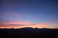 Landscape long exposure of majestic clouds in the sky sunset or sunrise over mountains. Beautiful colourful cloudscape