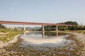 Landscape of the Lyduvenai Bridge over a river in the daylight in Lithuania