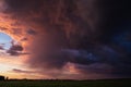 Landscape with majestic colorful dramatic red sky with fluffy clouds at sunset before before a thunderstorm and rain Royalty Free Stock Photo