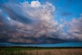 Landscape with majestic colorful dramatic red sky with fluffy clouds at sunset before before a thunderstorm and rain Royalty Free Stock Photo