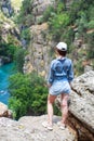 Landscape in Manavgat Turkey. happy girl on the steep slope. valley and cliff. Koprulu national Park