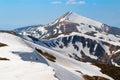 The landscape with the meadows, high mountains and peaks covered with snow. The place of tourists rest Carpathians Ukraine Europe.