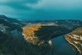 Landscape of a meander of a river at sunset on a cloudy day