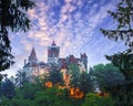 Landscape with medieval Bran castle known for the myth of Dracula at sunset Royalty Free Stock Photo