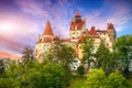 Landscape with medieval Bran castle known for the myth of Dracula at sunset Royalty Free Stock Photo