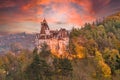 Landscape with medieval Bran castle at sunset Royalty Free Stock Photo
