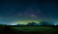 Landscape with Milky way galaxy. Night sky with stars over mountain. Long exposure photograph Royalty Free Stock Photo