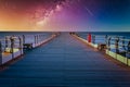 Landscape with Milky way galaxy and Sunset over pier at Saltburn by the Sea, North Yorkshire, UK Royalty Free Stock Photo