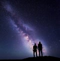 Landscape with Milky Way. Silhouette of a father and son Royalty Free Stock Photo