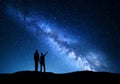 Landscape with Milky Way. Silhouette of a father and son Royalty Free Stock Photo