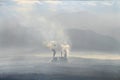 Landscape in mist and pollution. Factory pollutes the atmosphere harmful emissions. Greece