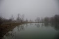 Landscape with misty morning fog in the Forest Lake or Beautiful forest lake in the morning at winter time. Azerbaijan nature. Royalty Free Stock Photo