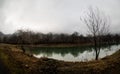 Landscape with misty morning fog in the Forest Lake or Beautiful forest lake in the morning at winter time. Azerbaijan nature. Royalty Free Stock Photo