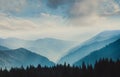 Landscape of misty mountains. View of coniferous forest, layers of mountain and haze in the hills at distance. Beautiful cloudy sk Royalty Free Stock Photo