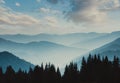 Landscape of misty mountains. View of coniferous forest, layers of mountain and haze in the hills at distance. Beautiful cloudy sk Royalty Free Stock Photo