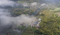 Landscape misty panorama. Fantastic dreamy sunrise on rocky mountains with view into misty valley below. Foggy clouds above Royalty Free Stock Photo