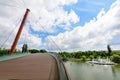 Landscape with the modern metallic, wooden and glass bridge in Drumul Taberei Park Parcul Drumul Taberei also known as Moghioros