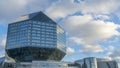 Landscape with modern National library building in Belarus on classic blue sky with clouds background. Space for text.