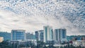 Landscape of modern office buildings under a blue cloudy sky in Kigali, Rwanda