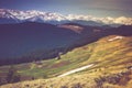 Landscape of morning twilight in the spring mountains. View of the snow-capped peaks. Royalty Free Stock Photo