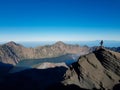 Landscape of Mount Rinjani and a climber who is at the top of Rinjani