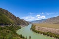 Landscape of the mountain chain of the Altai covered with green trees and rocks, with the turquoise Katun River and its rapids on Royalty Free Stock Photo