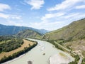 Landscape of the mountain chain of the Altai covered with green trees and rocks, with the turquoise Katun River and its rapids on Royalty Free Stock Photo