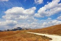 Landscape with a mountain country road. Balkans, Montenegro, Krnovo field Royalty Free Stock Photo