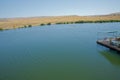 Landscape of an mountain lake in front of mountain range. Glorious lake landscape. The collaboration of blue and green. Multiple