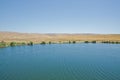 Landscape of an mountain lake in front of mountain range. Glorious lake landscape. The collaboration of blue and green. Multiple