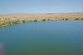 Landscape of an mountain lake in front of mountain range. Glorious lake landscape. The collaboration of blue and green. Multiple