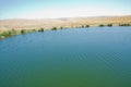 Landscape of an mountain lake in front of mountain range. Glorious lake landscape. The collaboration of blue and green. Multiple