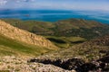 Landscape of the mountain peak, foggy lake, village and lake background Royalty Free Stock Photo