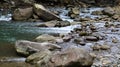 Landscape of a mountain river in the forest in early autumn and late summer. water in a natural stream. beautiful and relaxing Royalty Free Stock Photo