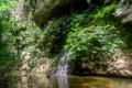 Landscape of mountain with waterfall and river in the tropical jungles in Gunung Mulu National park. Royalty Free Stock Photo