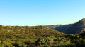 Landscape Mountains of Alicante, green bushes, grass, sunset, blue sky, Spain Royalty Free Stock Photo