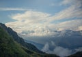 Landscape on mountains with clouds. Bird`s eye view. Early, Sunny morning. Sochi. Krasnaya Polyana. A soft picture. Royalty Free Stock Photo