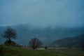 Landscape of mountains with cloudy sky and fog on a cloudy day. Autumn rainy day Royalty Free Stock Photo