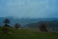 Landscape of mountains with cloudy sky and fog on a cloudy day. Autumn rainy day Royalty Free Stock Photo