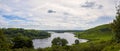 Landscape with mountains, forest and a river in front. beautiful scenery