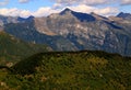 Landscape with mountains and green hills in the foreground on Mount Cimetta, near Locarno in Switzerland Royalty Free Stock Photo