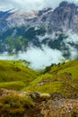 landscape with mountains, hills, rocks, trees and fog