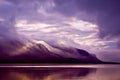 Landscape. Mountains and lake in mist in morning with purple col Royalty Free Stock Photo