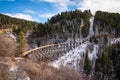 Sunset, landscape image of mountains and a train track in New Mexico dusted with snow. Royalty Free Stock Photo