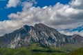 Landscape with the mountains in snow and heavy clouds in the background Royalty Free Stock Photo