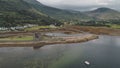 Landscape of mountains valley village at whisky distillery. Cinematic nobody nature seascape